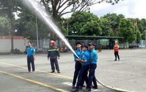 Fire drill rehearsal with water hose